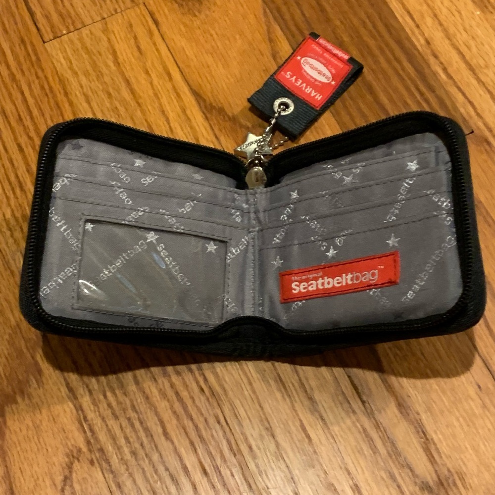 Harveys Seatbeltbag bill fold wallet with full zip closure. Black